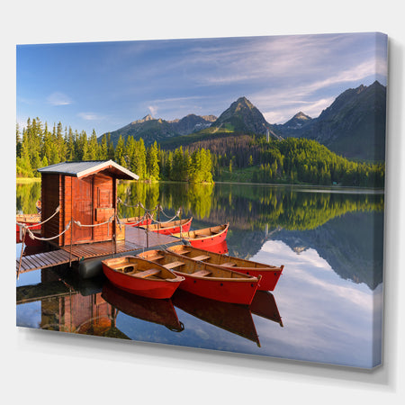 Red boat in a mountain lake - Lake Landscapes Photographic on wrapped Canvas