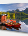 Red boat in a mountain lake - Lake Landscapes Photographic on wrapped Canvas