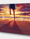 Man feet running in Sunset - People Sea & Shore Photographic on wrapped Canvas