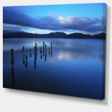 Dark Blue Sea with Pier Remains - Seascape Photo Canvas Print