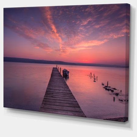 Wooden Pier Under Red Sky - Seascape Photo Canvas Print