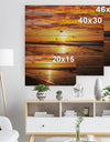 Bright Yellow Sunset over Waves - Modern Beach Print on Natural Pine Wood