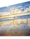 Blue Sky and Clouds Mirrored in Sea - Seashore Print on Natural Pine Wood