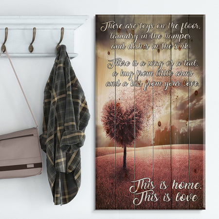 There toys on the floor. Pink Tree heart landscape - Textual Entrance Art on Wood Wall Art